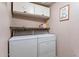 Bright laundry room with a washer, dryer, and storage cabinets at 16734 E La Montana Dr # 103, Fountain Hills, AZ 85268