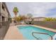 Outdoor pool area with palm trees and lounge seating at 16734 E La Montana Dr # 103, Fountain Hills, AZ 85268