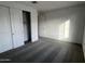 Bright bedroom featuring gray carpeting, large closet and neutral walls at 18032 W Vogel Ave, Goodyear, AZ 85338