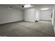 Spacious garage with concrete floor and ample lighting at 18032 W Vogel Ave, Goodyear, AZ 85338