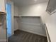 Walk-in closet with shelving and hanging racks at 18032 W Vogel Ave, Goodyear, AZ 85338