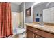 Bathroom with shower-tub combination, granite vanity, and neutral wall paint at 20194 N Riverbank Rd, Maricopa, AZ 85138