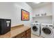 A laundry room with modern washer and dryer at 20194 N Riverbank Rd, Maricopa, AZ 85138