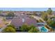 Aerial view showing a pool, and verdant landscaping creating a private and serene outdoor space at 2020 E Norwood St, Mesa, AZ 85213