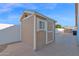 Wooden storage shed in backyard with privacy wall at 2020 E Norwood St, Mesa, AZ 85213