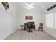 Cozy bedroom featuring a ceiling fan, desk, and closet, perfect for work or relaxation at 2020 E Norwood St, Mesa, AZ 85213