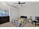 Cozy bedroom with a bed, neutral carpeting, ceiling fan and closet creating a peaceful retreat within the home at 2020 E Norwood St, Mesa, AZ 85213