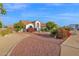 Beautiful home featuring lush landscaping, vibrant flowers, and a well-manicured front yard at 2020 E Norwood St, Mesa, AZ 85213