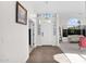 Welcoming foyer with hardwood floors, a stylish light fixture, and ample natural light at 2020 E Norwood St, Mesa, AZ 85213