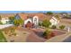 Beautiful front exterior with manicured landscaping, a seating area, and a spacious garage, enhancing curb appeal at 2020 E Norwood St, Mesa, AZ 85213