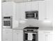 Close-up of kitchen details including stainless steel appliances, oven, and microwave at 2020 E Norwood St, Mesa, AZ 85213