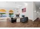 Inviting living room featuring vaulted ceilings, a cozy fireplace, and seamless access to the outdoor area through glass sliders at 2020 E Norwood St, Mesa, AZ 85213