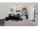 Spacious main bedroom featuring a fireplace, ceiling fan, and patio access, creating a comfortable retreat at 2020 E Norwood St, Mesa, AZ 85213