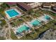 Aerial view of the community pools surrounded by palm trees, lounge chairs, and manicured landscaping at 20392 W Brittlewood Ave, Buckeye, AZ 85396