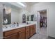 Bright bathroom features double vanity with plenty of storage and an adjacent walk-in closet at 20392 W Brittlewood Ave, Buckeye, AZ 85396