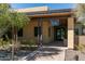 A building featuring 'The Spa' signage with a covered entrance, desert landscaping, and walkway at 20392 W Brittlewood Ave, Buckeye, AZ 85396