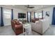 Cozy living room featuring tile flooring, recessed lighting, neutral walls with ceiling fan at 20392 W Brittlewood Ave, Buckeye, AZ 85396