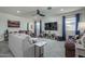 Bright living room with tile flooring, recessed lighting, neutral walls, and comfortable seating arrangements at 20392 W Brittlewood Ave, Buckeye, AZ 85396