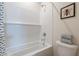 Clean bathroom featuring a tub with white subway tiles and coordinated decor at 2180 N Iowa St, Chandler, AZ 85225