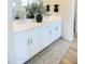 Bathroom featuring a double sink vanity, modern mirror, and stylish decor at 2180 N Iowa St, Chandler, AZ 85225