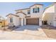 Charming two-story home with a two car garage, low maintenance yard and neutral color scheme at 2180 N Iowa St, Chandler, AZ 85225