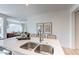 Kitchen island with quartz countertops and seating faces the living area in this open floor plan at 2180 N Iowa St, Chandler, AZ 85225