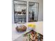 Close up of kitchen island with white countertop, fruit, and open kitchen at 2180 N Iowa St, Chandler, AZ 85225