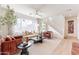 Comfortable living room filled with natural light features stairs to the second story at 2180 N Iowa St, Chandler, AZ 85225