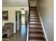 Inviting entryway with staircase and view into the sunny living spaces at 2233 W Farmdale Ave # 2, Mesa, AZ 85202