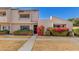 Charming townhome featuring desert landscaping and colorful flowering bushes at 2233 W Farmdale Ave # 2, Mesa, AZ 85202