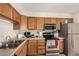 Well-equipped kitchen featuring stainless steel appliances and abundant cabinet space at 2233 W Farmdale Ave # 2, Mesa, AZ 85202