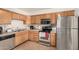 Functional kitchen featuring stainless steel appliances and ample cabinet space at 2233 W Farmdale Ave # 2, Mesa, AZ 85202