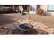 Backyard with desert landscaping, a cozy outdoor seating area, and a fire pit at 2303 E Wescott Dr, Phoenix, AZ 85024