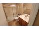 Bathroom features a single vanity, toilet, and shower-tub combo with sliding glass doors at 2303 E Wescott Dr, Phoenix, AZ 85024