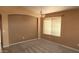 Bright dining room with a modern light fixture and large window for ample natural light at 2303 E Wescott Dr, Phoenix, AZ 85024