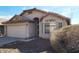 Exterior view of a single-story home with neutral stucco, tile roof, and desert landscaping at 2303 E Wescott Dr, Phoenix, AZ 85024