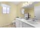 Bathroom featuring a double vanity with marble countertop and tile flooring at 2421 E Del Rio Dr, Tempe, AZ 85282