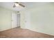 Bright bedroom with a closet, overhead fan, and views of the hallway at 2421 E Del Rio Dr, Tempe, AZ 85282