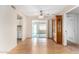 Bright dining area with wood floors, sliding doors, and adjacent kitchen access at 2421 E Del Rio Dr, Tempe, AZ 85282