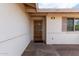 Home's exterior showcasing a secure front door with brick accents and visible house number at 2421 E Del Rio Dr, Tempe, AZ 85282