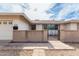 Home exterior featuring well-maintained desert landscaping and a charming gated entrance at 2421 E Del Rio Dr, Tempe, AZ 85282