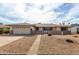 Charming single-story home with a two-car garage and beautiful desert landscaping at 2421 E Del Rio Dr, Tempe, AZ 85282