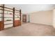 Spacious living room with open shelving and neutral carpeting at 2421 E Del Rio Dr, Tempe, AZ 85282