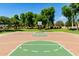 Well-maintained basketball court surrounded by lush greenery, perfect for recreational activities at 2701 E Hobart St, Gilbert, AZ 85296