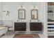 Stylish bathroom features double sinks with dark vanities and patterned tile floors at 2701 E Hobart St, Gilbert, AZ 85296