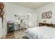 Bright bedroom with a white desk, white walls, and neutral floors at 2701 E Hobart St, Gilbert, AZ 85296