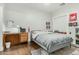 This bedroom features a wooden desk, a bed, and decor with sports memorabilia at 2701 E Hobart St, Gilbert, AZ 85296