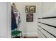 Walk-in closet with custom shelving, hanging storage and sports memorabilia on display at 2701 E Hobart St, Gilbert, AZ 85296