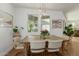 Elegant dining area with a wooden table, stylish chairs, and modern pendant lights at 2701 E Hobart St, Gilbert, AZ 85296