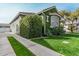 Charming home with lush landscaping, a gray stucco exterior, and inviting curb appeal at 2701 E Hobart St, Gilbert, AZ 85296